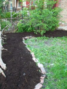 brick lined raised garden bed