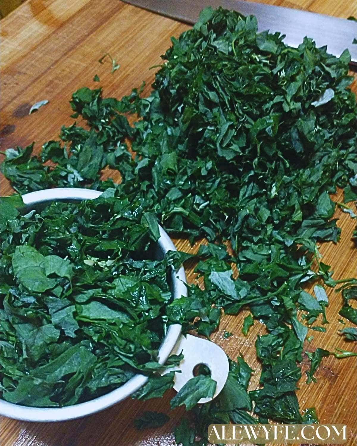 measuring chopped fresh lambsquarter greens.