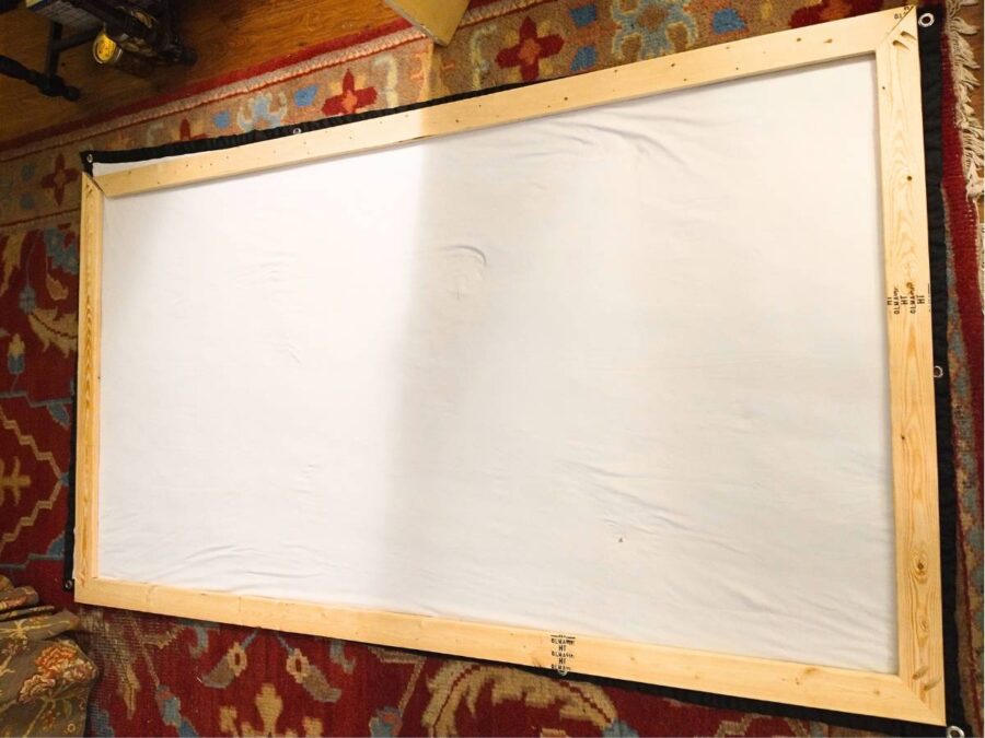 laying out the pre-drilled frame over the screen while securing the corners with pocket screws