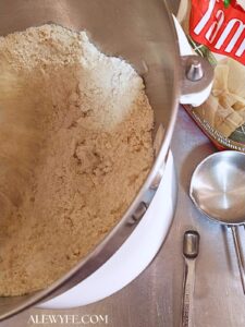 stand mixer with dry masa dough ingredients and the fat cut in until crumbly