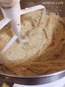 stand mixer with paddle attachment and fully mixed tamale pie masa dough