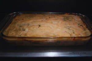 creamy chicken tamale pie casserole baking in the oven