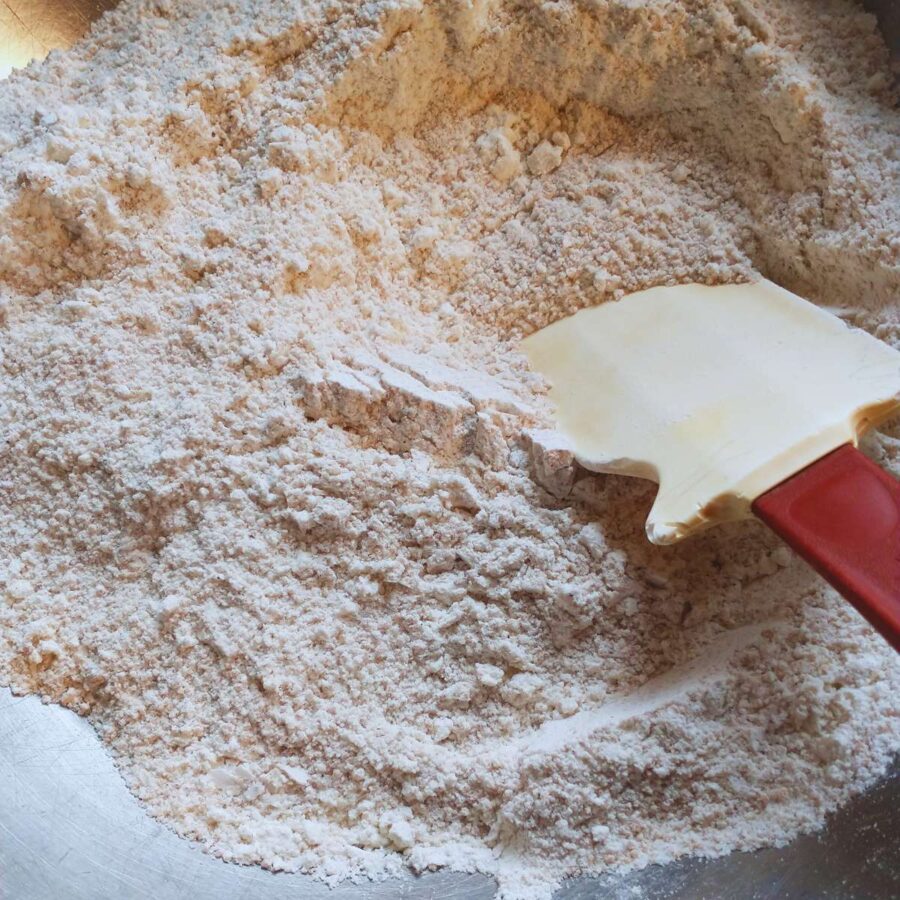 dry ingredients for vegan pumpkin spice cookies mixed in a stainless bowl