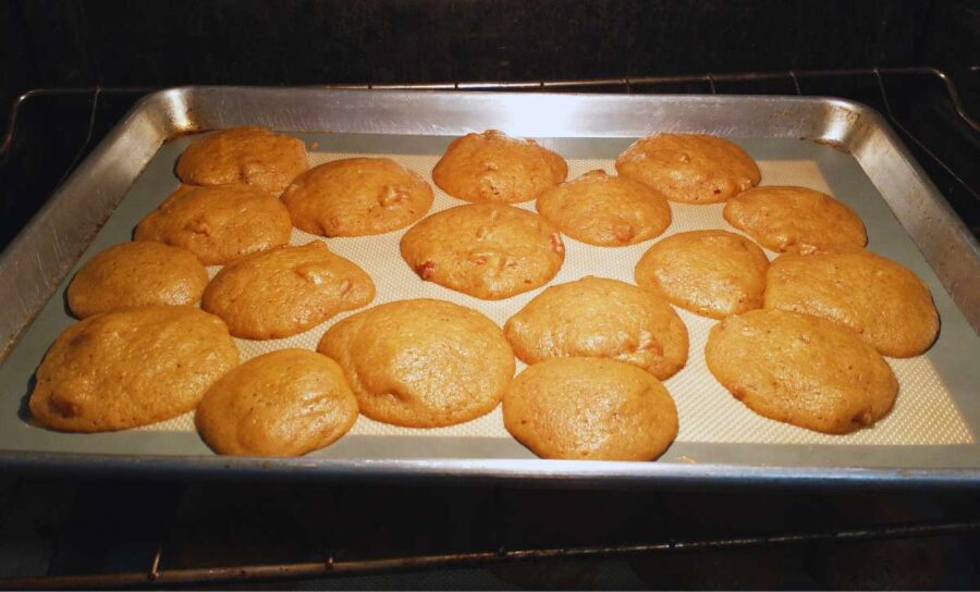 vegan pumpkin spice cookies baking in the oven.