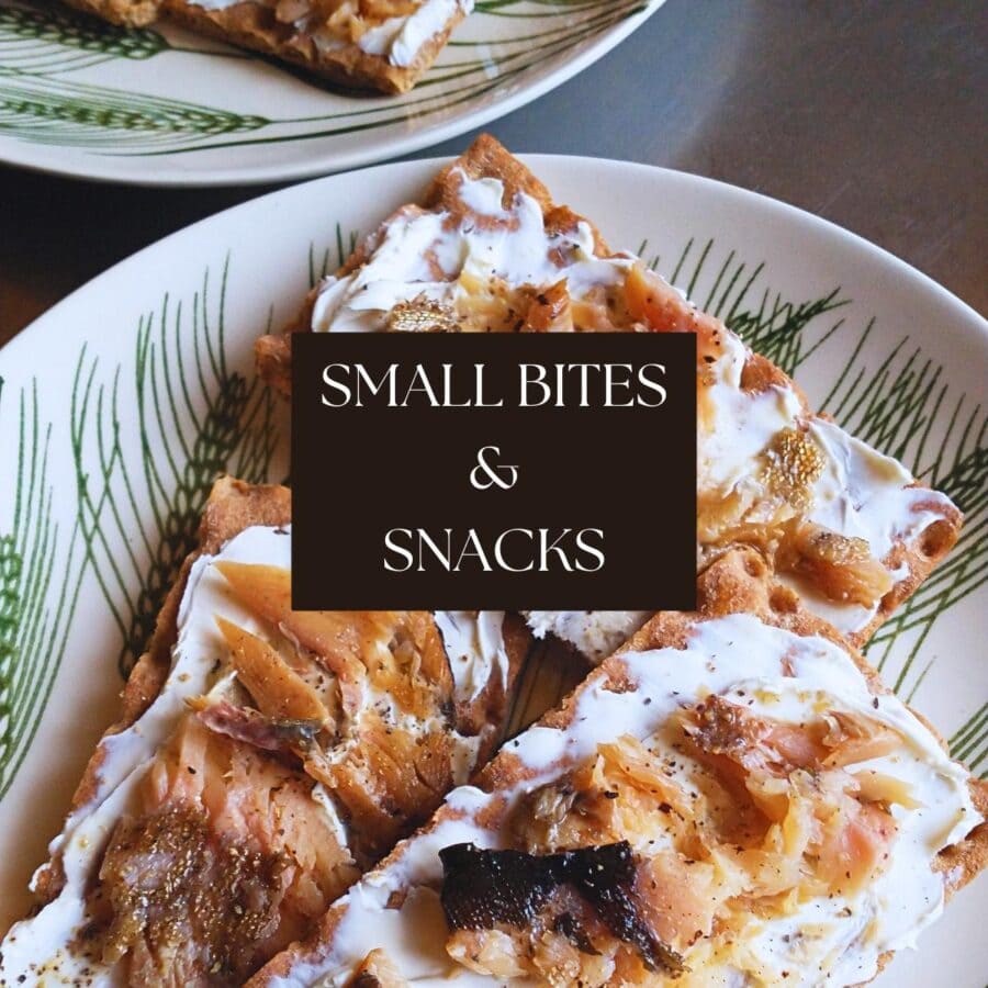 Small Bites & Snacks title image card (text box over a photo of crispbread crackers spread with cream cheese and topped with smoked fish and black pepper)
