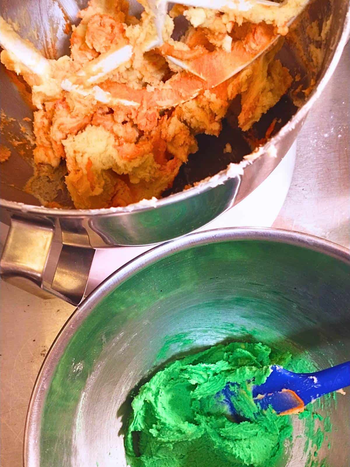 dividing and dying dough for piped pumpkin spritz cookies.