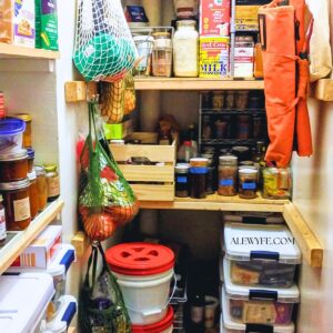 photo of a deep working pantry with shelves full of food and storage containers