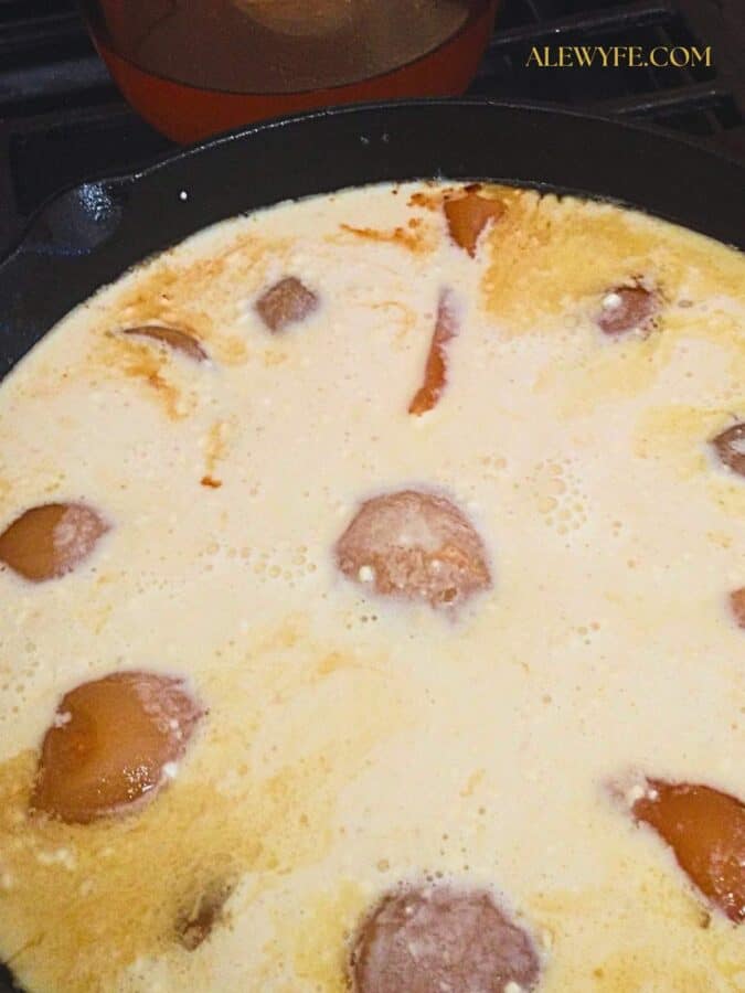 pear dutch baby batter in the pan before baking