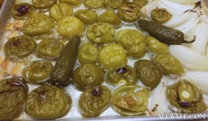roasted tomatillos, peppers, onions, and garlic on a sheet pan
