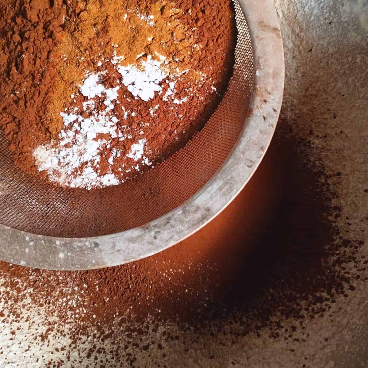 homemade hot chocolate mix ingredients being sifted together