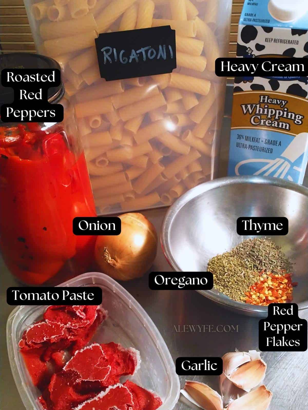 labeled photo of all ingredients for roasted red pepper cream sauce rigatoni