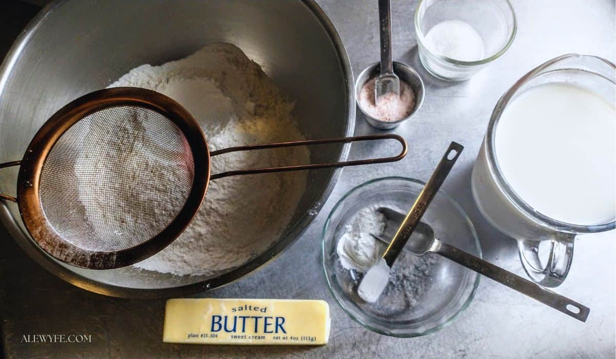 ingredients for homemade butter-swim biscuit mix (flour, butter, salt, sugar, leavening, buttermilk).