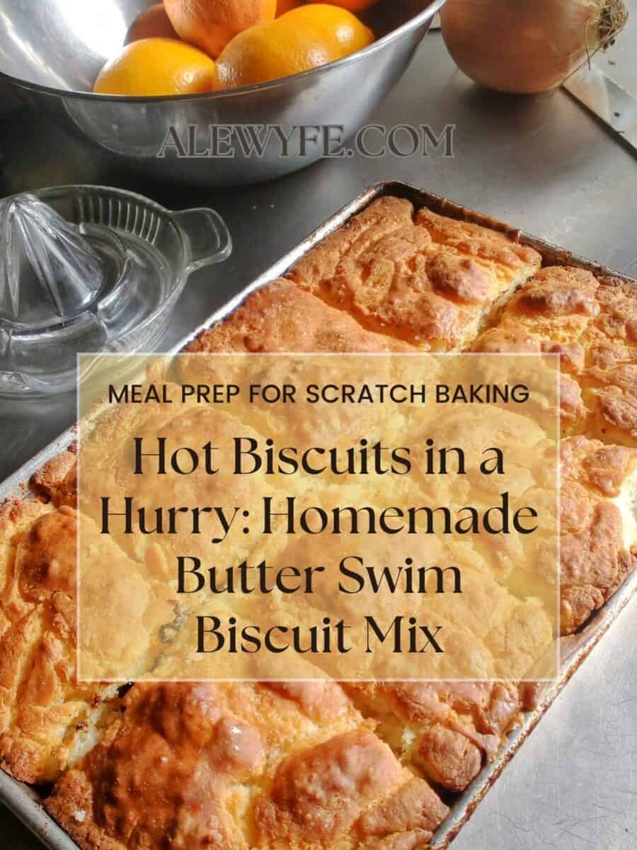 title image for butter swim biscuit mix post. a pan of freshly baked biscuits next to a bowl of citrus fruit with text box "alewyfe.com meal prep for scratch baking hot biscuits in a hurry: homemade butter swim biscuit mix"