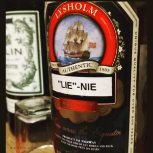a bottle of Linie aquavit, with a homemade label spelled "lie" -nie ( a pun on the name since the contents are homemade).