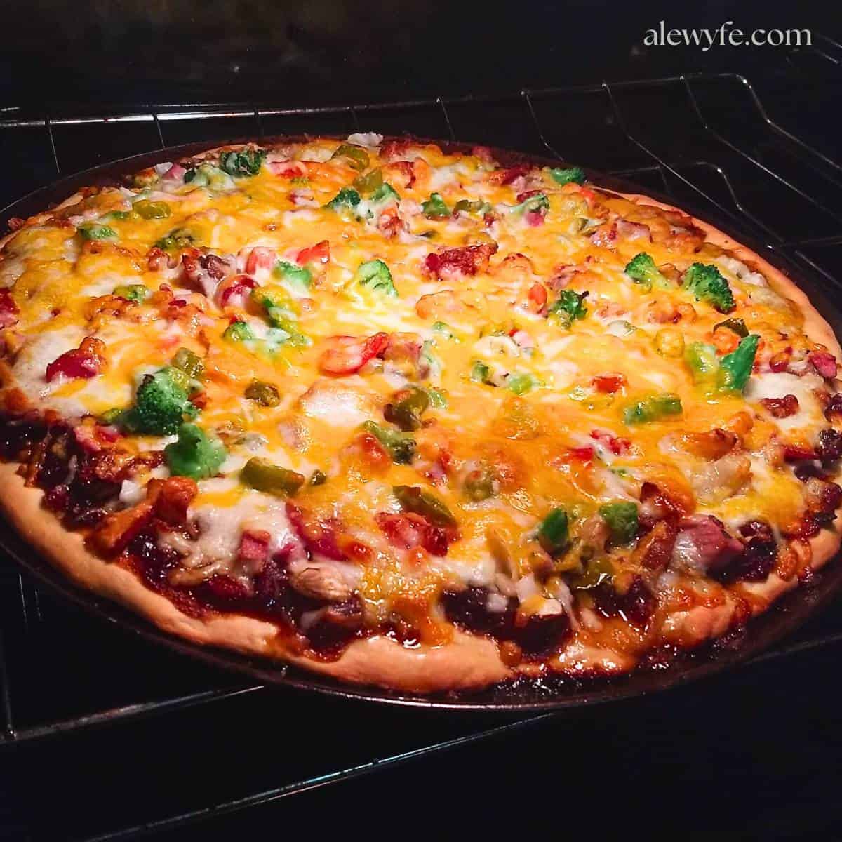 a homemade pizza baking in the oven.