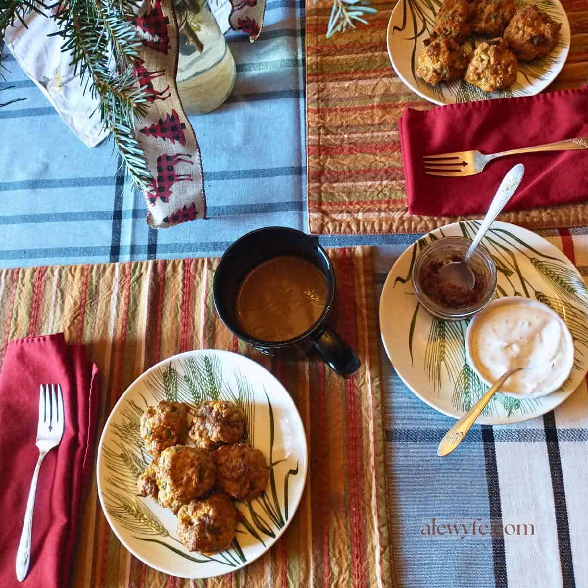 southern sausage balls on small plates, with sauces and a cup of coffee.