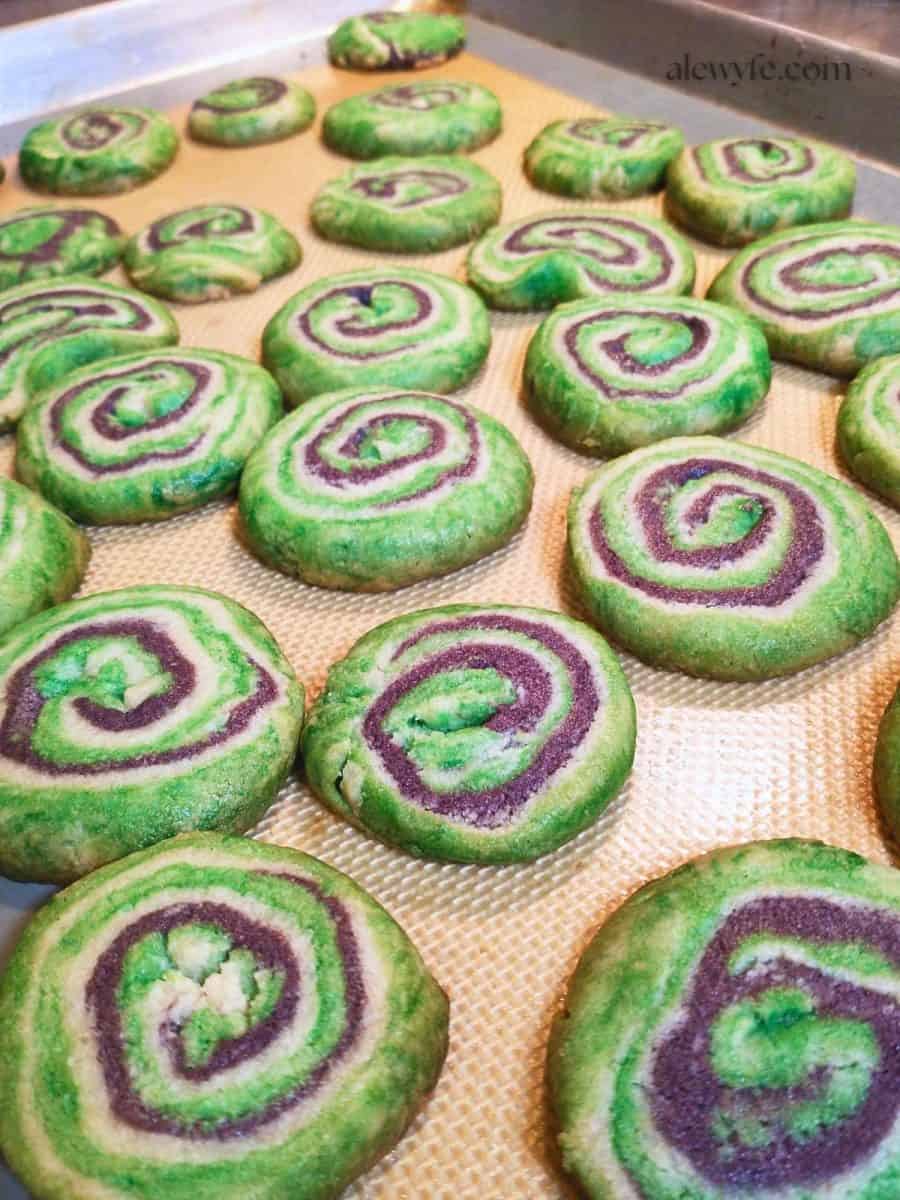 spooky spiral pinwheel cookies with green, white, and purple swirls.