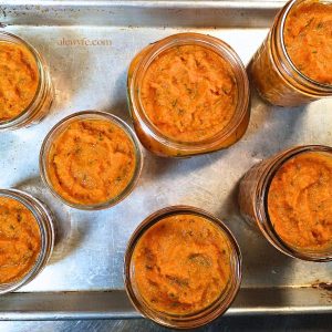 top-down view of jars of habanero carrot butter before canning.