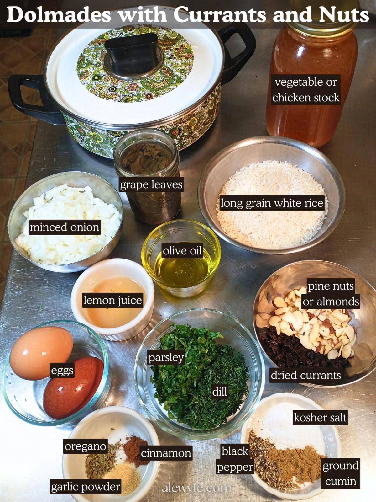 labeled ingredient photo for vegetarian dolmades recipe, showing all components laid out in small bowls, ready to combine and roll into stuffed grape leaves. 