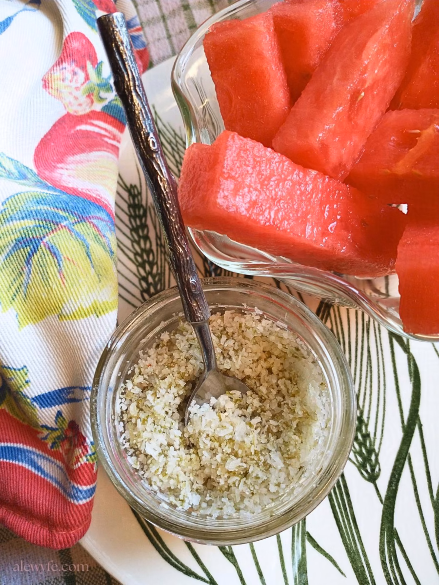 watermelon pieces with a bowl of homemade lime finishing salt.